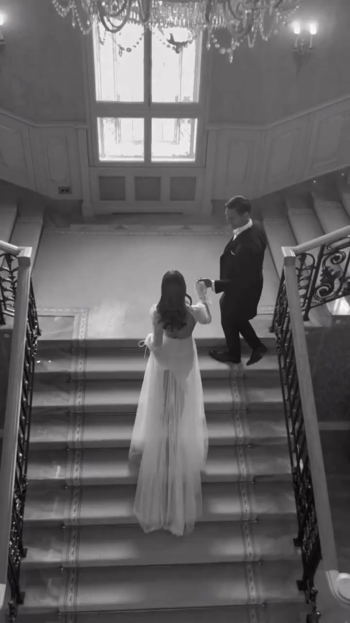 Vitali & Anna — the couple on the staircase at The Merion, from the opening film of the invitation